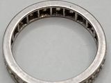 a close up of a ring on a table with a white background