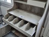 a shelf with a bunch of shoes in it