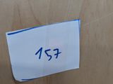 a sign on the door of a toilet that says 123