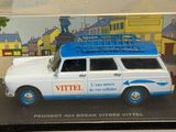a white van with a blue roof in a clear box