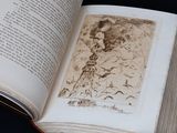 an open book with a drawing of a man on it