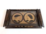 an old picture of two people in a picture frame on a wall