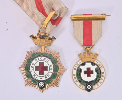 two medals with a red cross and a medal on a white background