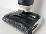 a black and white vacuum on a white table