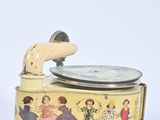 a small tin with a clock on top of it