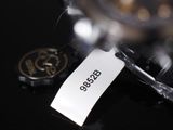 a tag on a watch that says boss on it