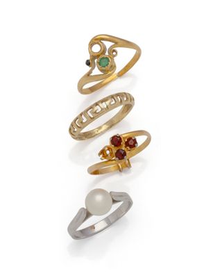 a set of five gold rings with different colored stones
