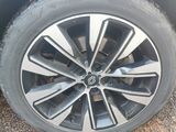 a close up of a tire on a car ' s rim