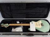 a case with a guitar inside of it on a white surface