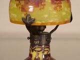 a lamp that is sitting on a table with a light on it