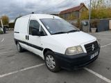 a white van that is parked in a parking lot