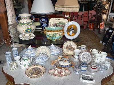 a table that has a lot of plates and cups on it