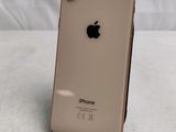 an apple iphone is sitting on a stand on a white surface