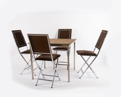 four chairs and a table set on a white background