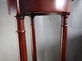 an image of a wooden chair with a brown leather seat