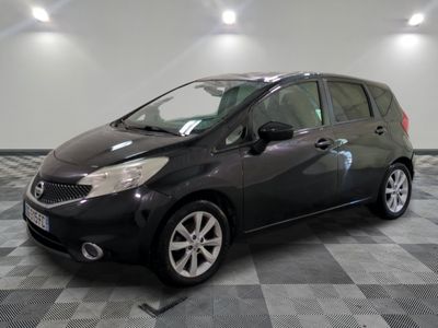 a picture of a small black car parked in a garage