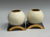two vases that are sitting on top of each other