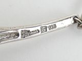 a close up of a spoon and fork on a table