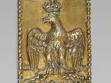 an image of a gold eagle with a crown on it ' s head