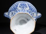 blue and white porcelain cup and saucer with floral decoration