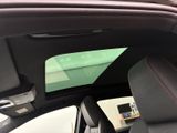 a view of a car ' s sunroof from the inside