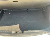 a trunk of a car with a seat folded down