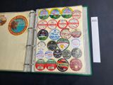 a binder with a lot of stickers on it