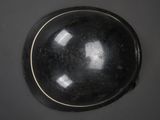 a black bowl sitting on top of a table