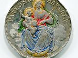 une image représentant une pièce d'argent sur laquelle figurent une femme et un enfant