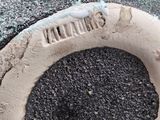 a close up of a vase with a hole in it