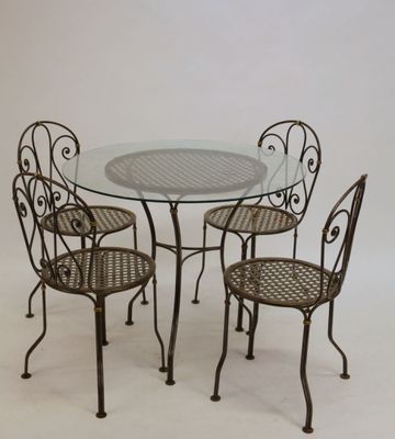 an image of a glass table with four chairs and a glass top