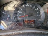 a close up of a car dashboard with a speedometer