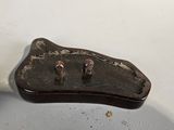 a small piece of metal that has been left on the table