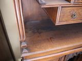 a wooden desk with a drawer on top of it