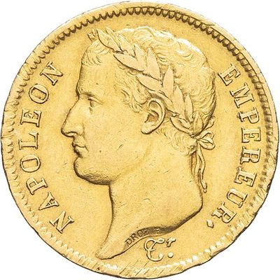 a close up of a gold coin on a white background