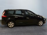 a picture of a small black car parked in a garage