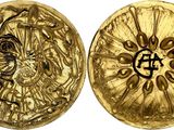 a close up of two gold coins on a white background