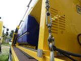 a yellow truck with a blue back and a yellow back