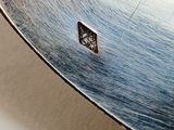 a close up of a metal object with a square hole in it