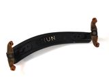 an image of a pair of black and brown hair clips on a white surface