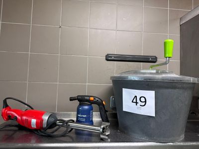 an image of a kitchen counter with a pot and a hammer