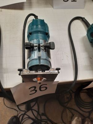 two electric tools on a table with a price tag