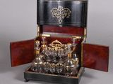 a silver plated tea set in a wooden case