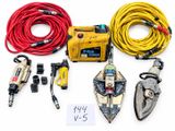 an assortment of tools and wires are laid out on a white surface