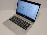 a laptop computer that is sitting on a table