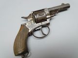 an old gun that is on a white surface