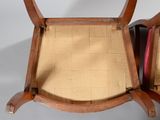 two chairs that are sitting next to each other