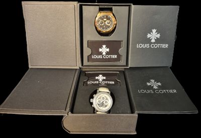a box with a watch inside of it on a black background
