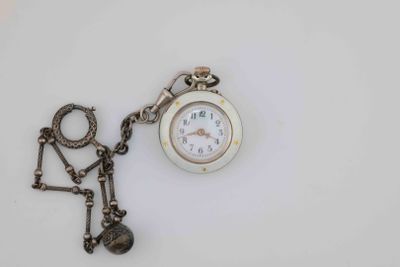 a small pocket watch with a chain attached to it
