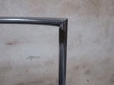 a close up of a glass shower door in a bathroom